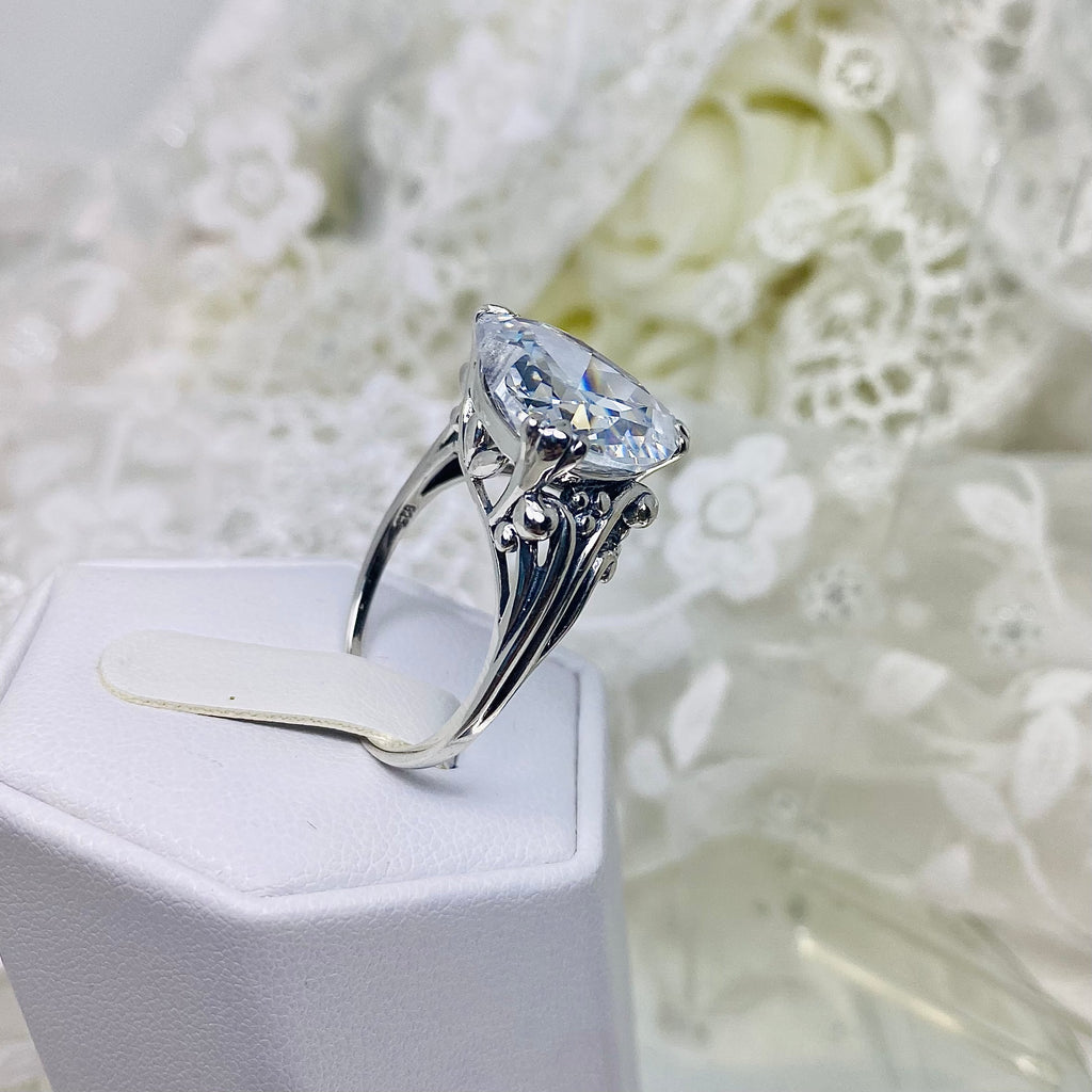 White CZ ring with a heart shaped gem and gothic style sterling silver filigree