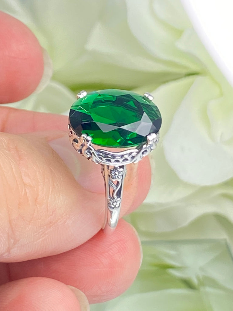 Emerald green Ring, Oval emerald green gemstone, sterling silver floral filigree, Edward Design #D70, in a hand