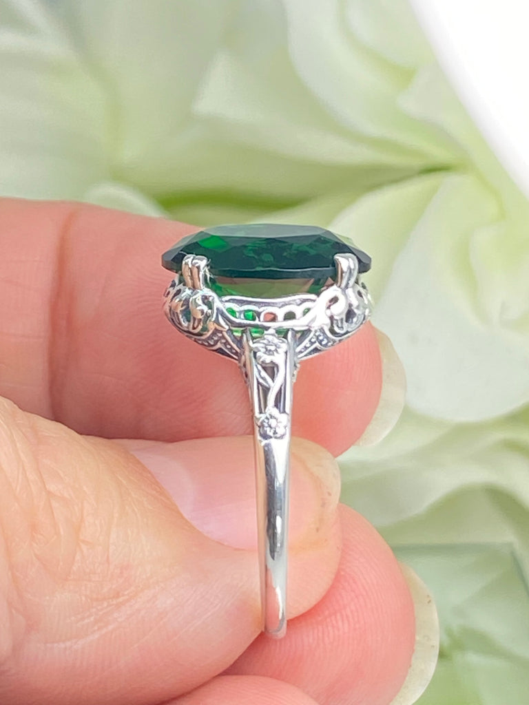 Emerald green Ring, Oval emerald green gemstone, sterling silver floral filigree, Edward Design #D70, in a hand