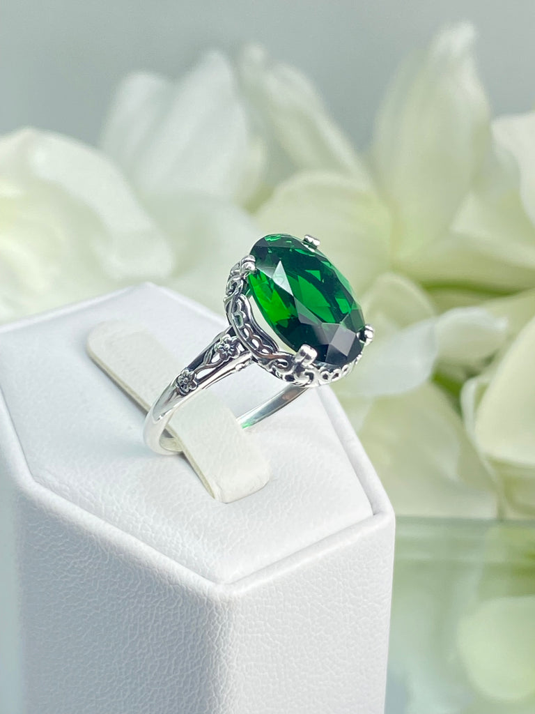 Emerald green Ring, Oval emerald green gemstone, sterling silver floral filigree, Edward Design #D70, on a ring holder
