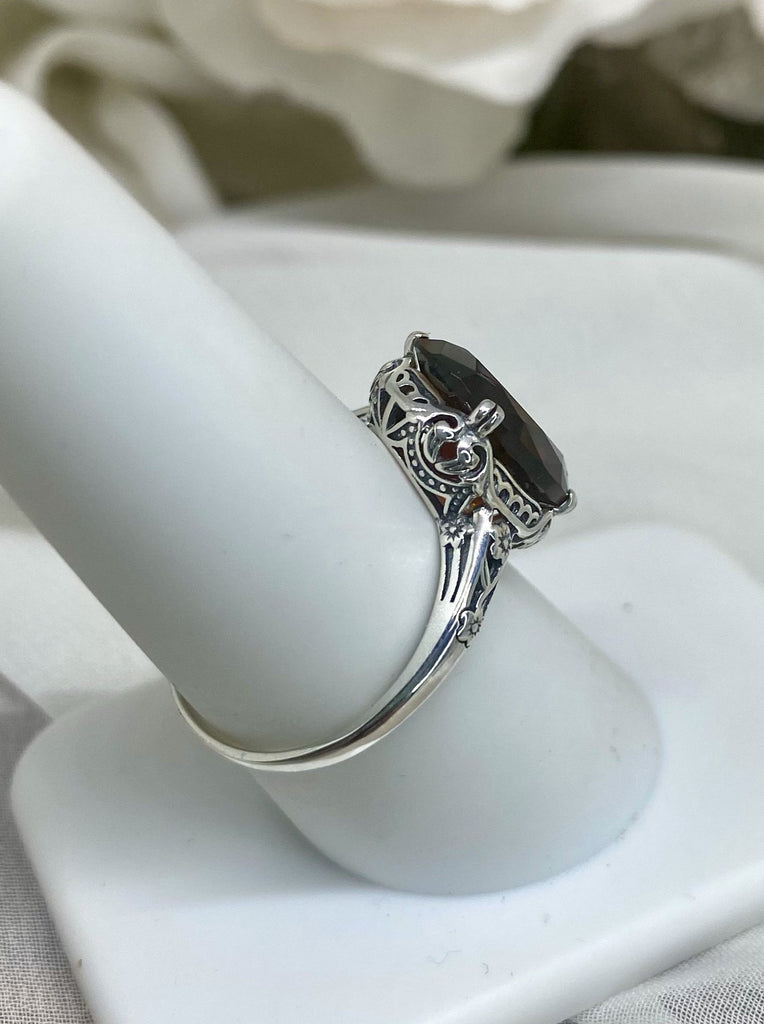 Simulated Red Garnet Ring, Sterling Silver floral filigree, Edward Design #D70, side and back view on a ring holder
