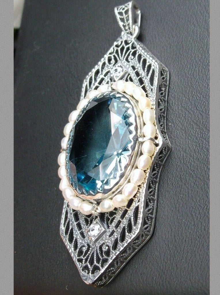 Aquamarine Pendant, Art Deco 1930s jewelry, seed pearl accents surround an oval gemstone with a sterling silver filigree background. two White CZs adorn above and below the large brilliant focal gemstone, Silver Embrace Jewelry necklace