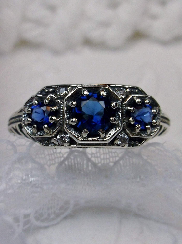 Art deco style ring with three blue sapphire gems set in sterling silver filigree