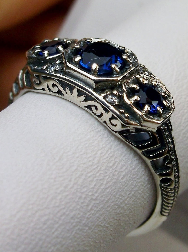 Art deco style ring with three blue sapphire gems set in sterling silver filigree