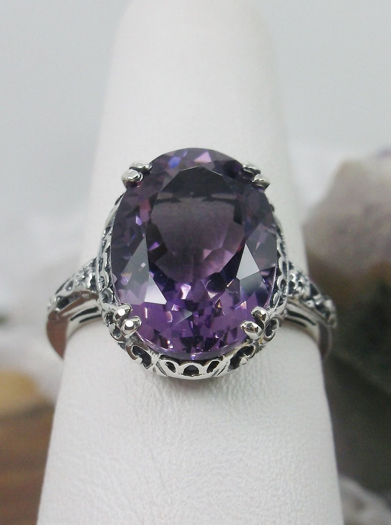 Front view of a Natural Purple Amethyst Sterling Silver Filigree Ring, Edward Design#70 on a ring holder