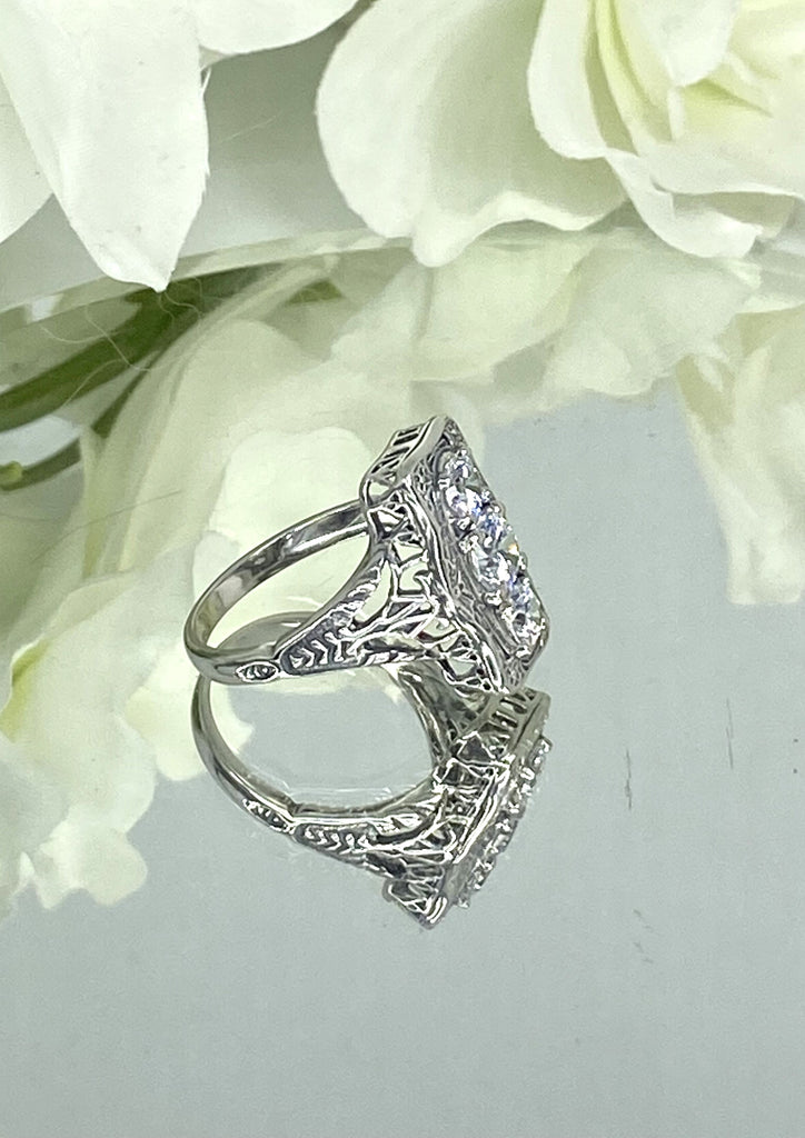 a close up of a ring on a flower, White CZ Ring, 3 round gems set in a rectangle design, Vintage style sterling silver filigree, D60 Three stone rectangle, Trinity ring