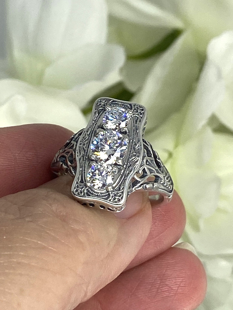 a close up of a person holding a ring, White CZ Ring, 3 round gems set in a rectangle design, Vintage style sterling silver filigree, D60 Three stone rectangle, Trinity ring