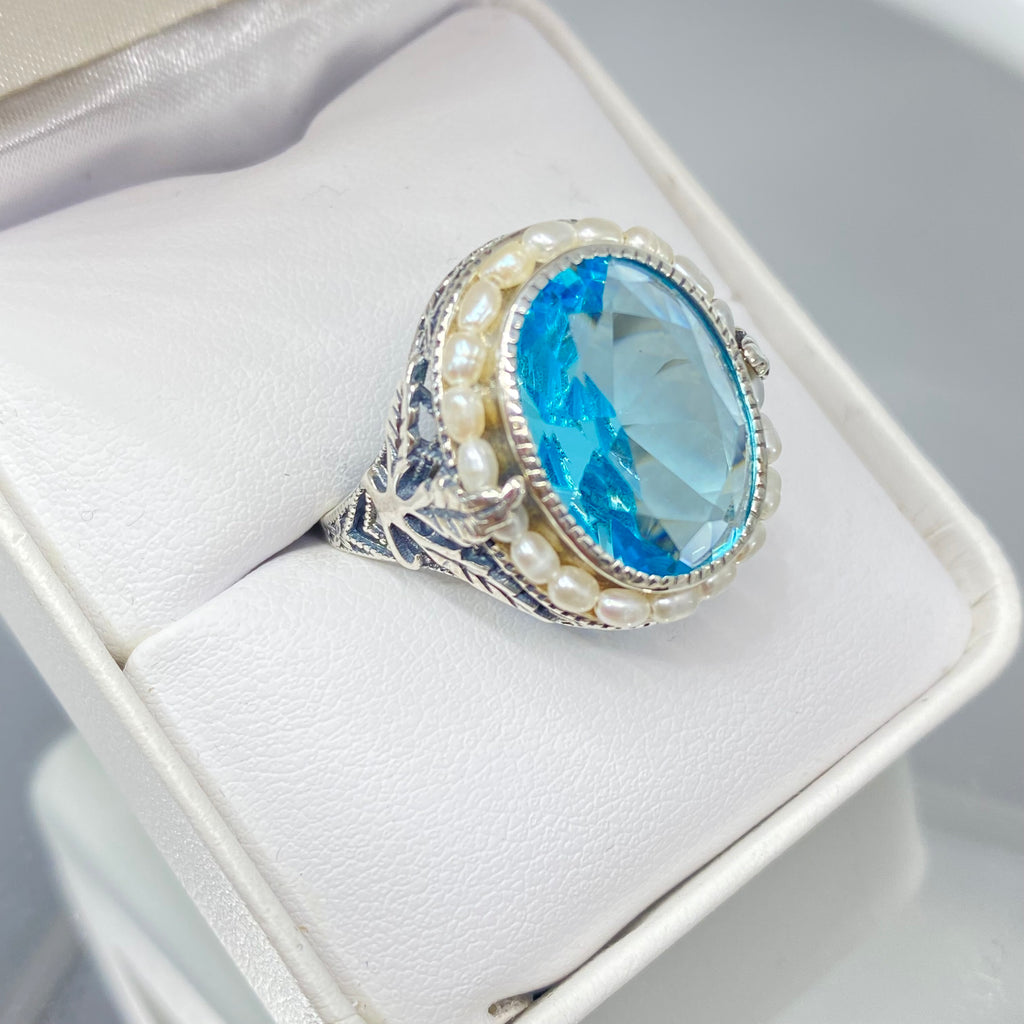 Blue Aquamarine Ring, Sterling Silver Leaf Filigree, Pearl Frame, Vintage Jewelry, Silver Embrace Jewelry, D8 Leaf Pearl Design, Ring with blue gemstone and pearl accents in a white jewelry box