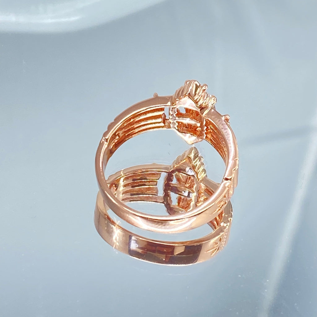 Rose gold ring with multiple sparkling gems on a mirror, a three stone ring with a White CZ center. Rose Gold plated Sterling Silver Art Deco Filigree, fine detail, Silver Embrace Jewelry, Xanadu D164