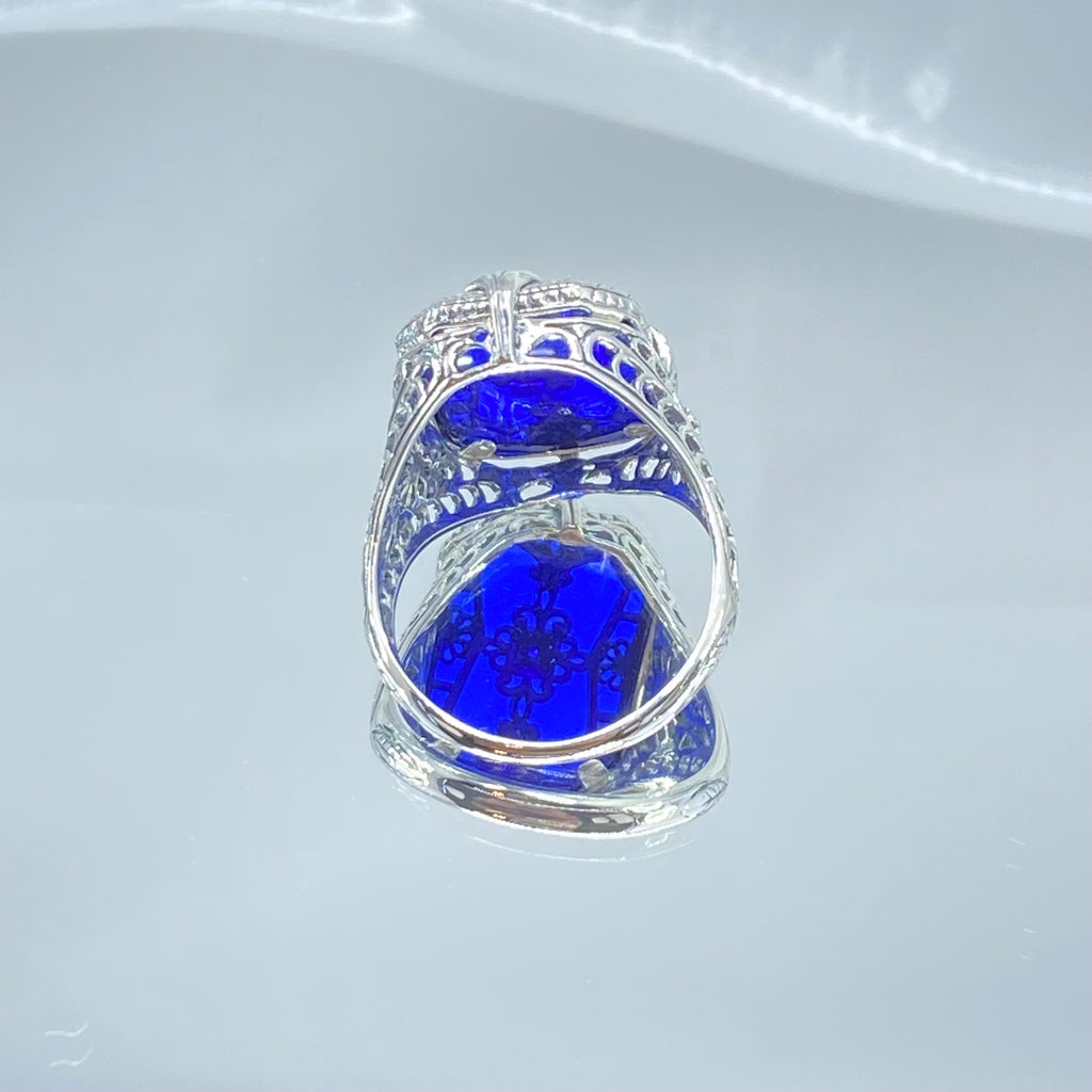 Sapphire Blue Glass Ring with Sterling Silver Art Deco Filigree and a single white CZ in the center of the pane sections