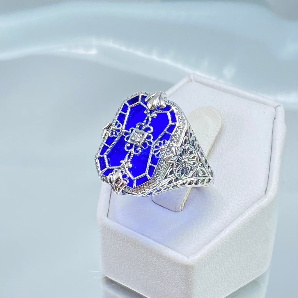 Sapphire Blue Glass Ring with Sterling Silver Art Deco Filigree and a single white CZ in the center of the pane sections