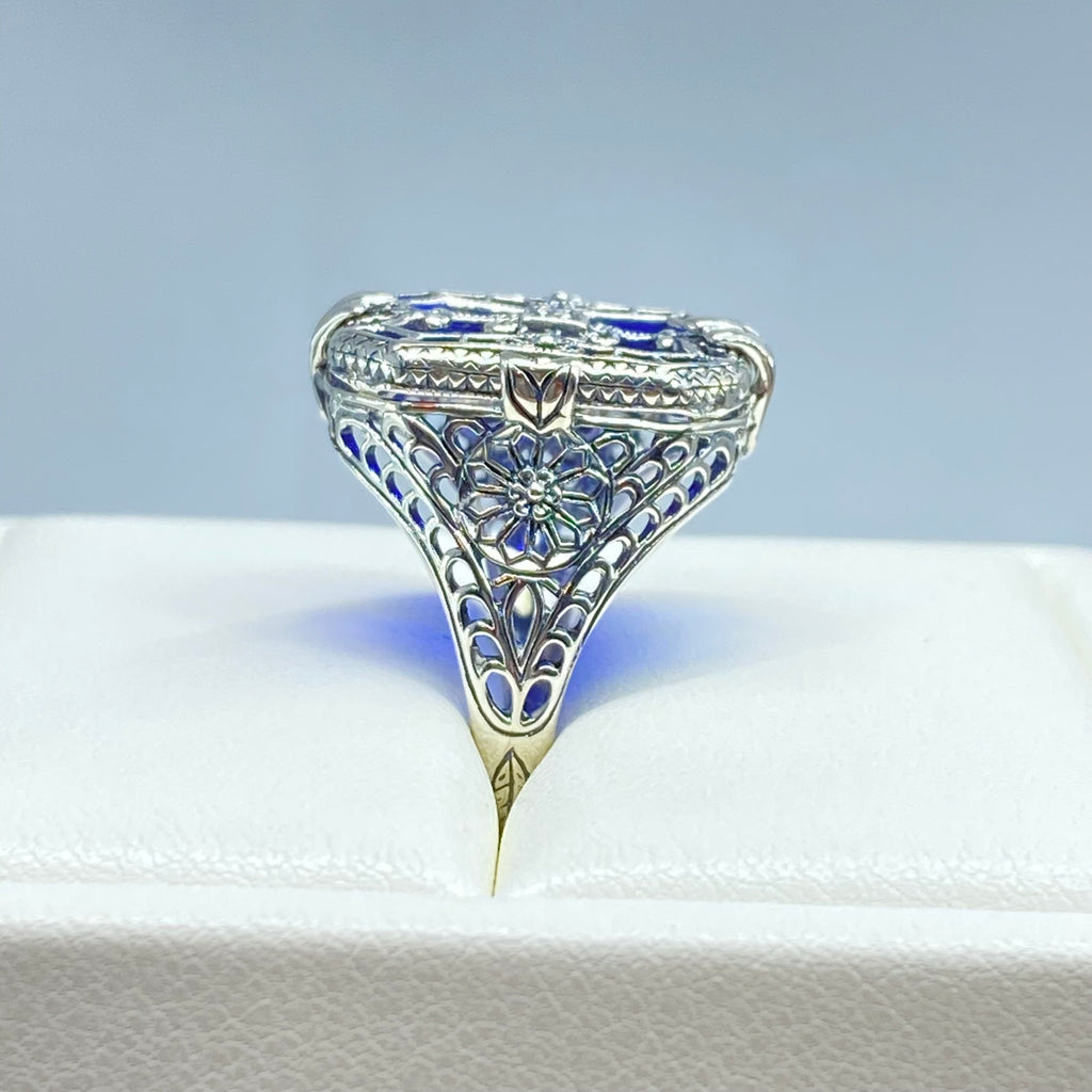 Sapphire Blue Glass Ring with Sterling Silver Art Deco Filigree and a single white CZ in the center of the pane sections