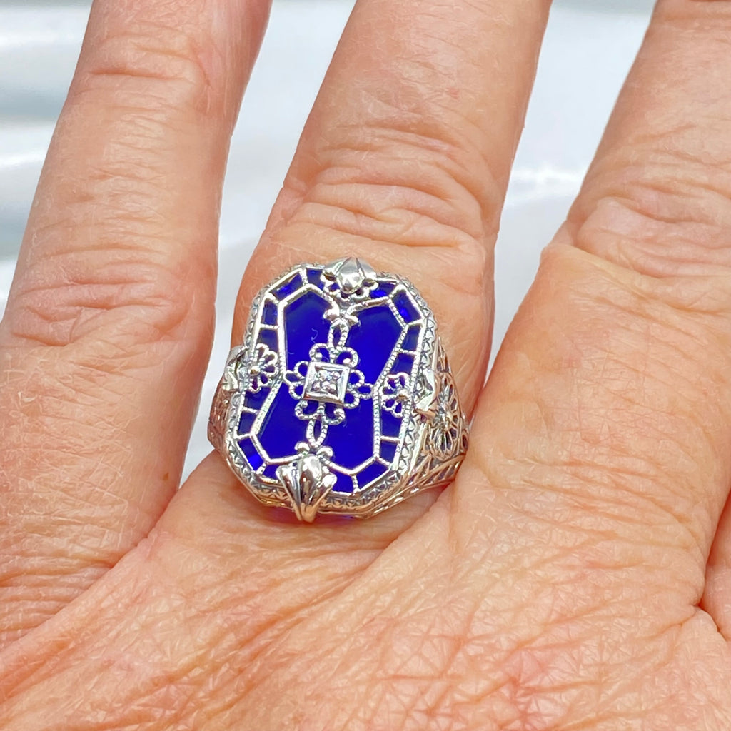 Sapphire Blue Glass Ring with Sterling Silver Art Deco Filigree and a single white CZ in the center of the pane sections