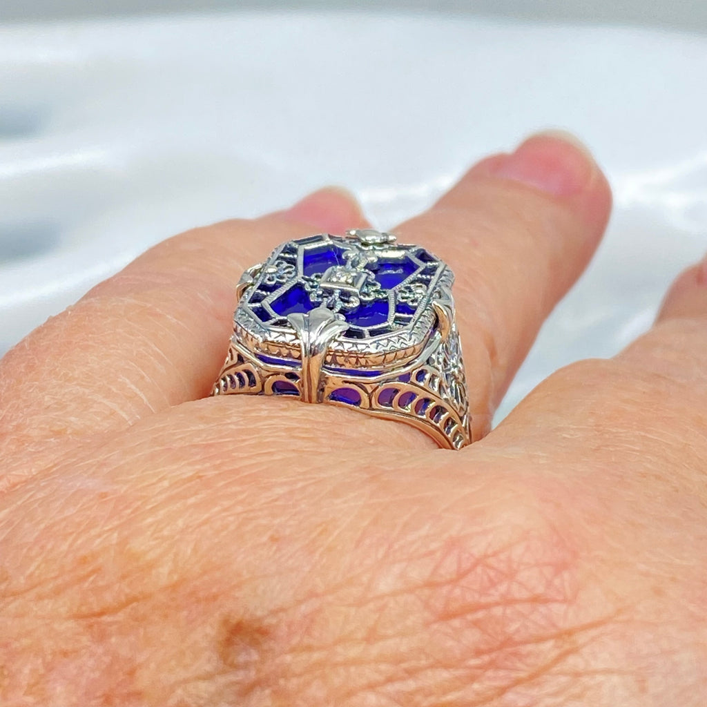 Sapphire Blue Glass Ring with Sterling Silver Art Deco Filigree and a single white CZ in the center of the pane sections