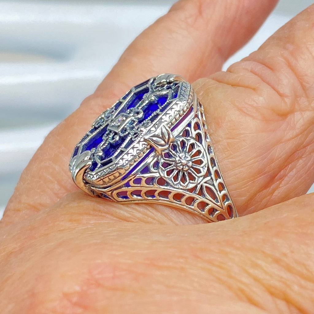 Sapphire Blue Glass Ring with Sterling Silver Art Deco Filigree and a single white CZ in the center of the pane sections