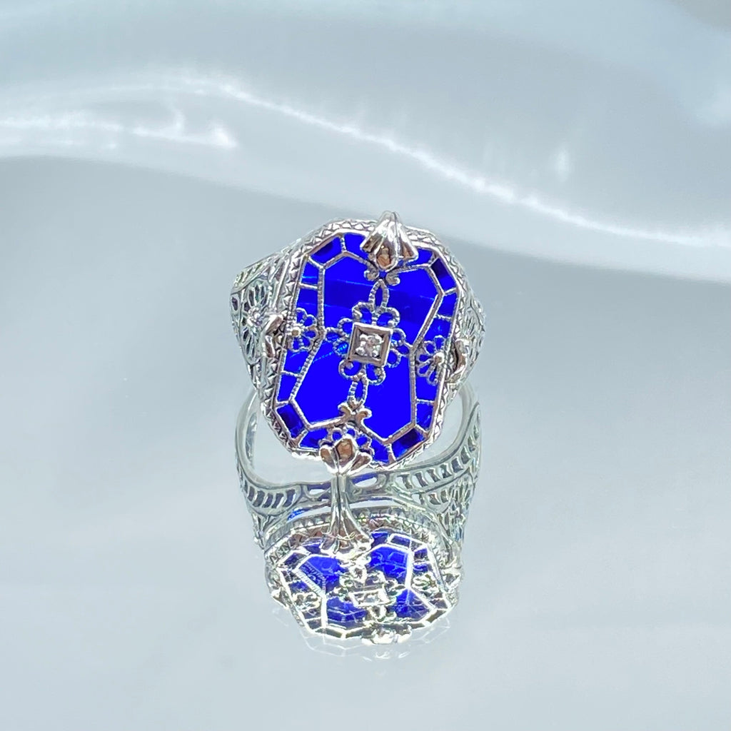 Sapphire Blue Glass Ring with Sterling Silver Art Deco Filigree and a single white CZ in the center of the pane sections