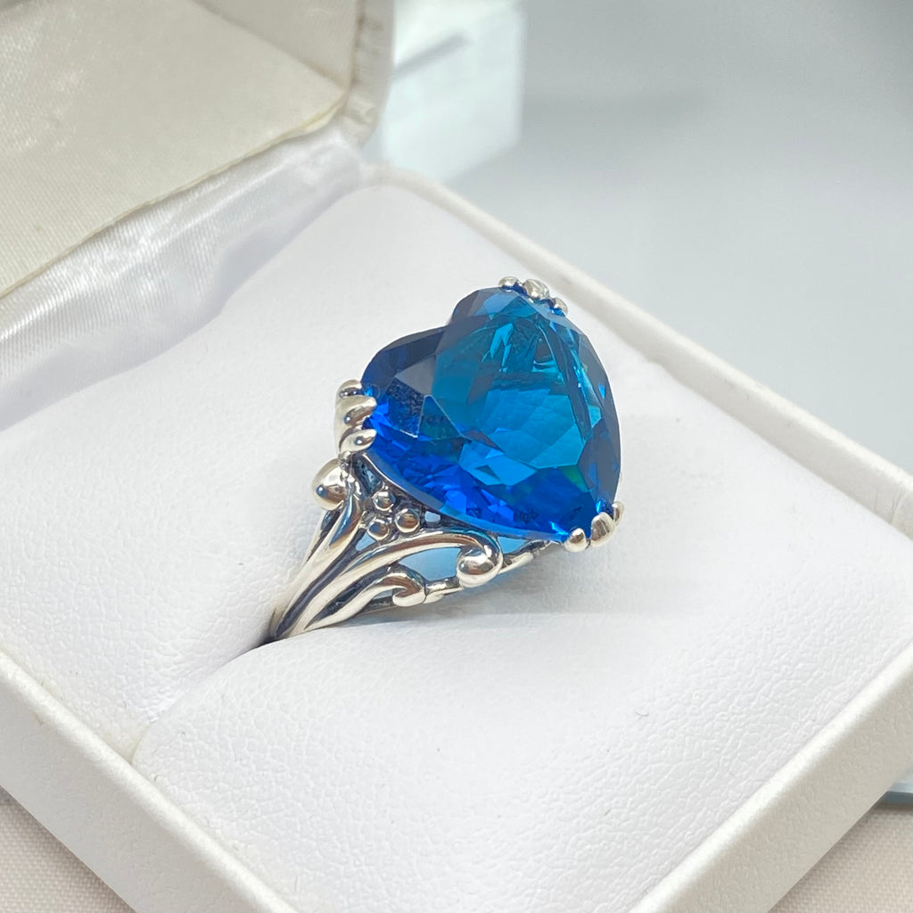 London Blue Topaz ring with a heart shaped gem and gothic style sterling silver filigree