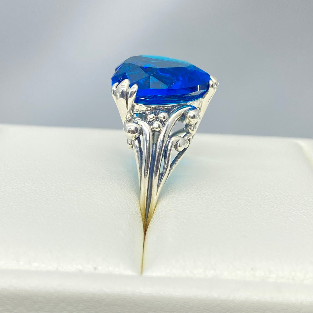 London Blue Topaz ring with a heart shaped gem and gothic style sterling silver filigree