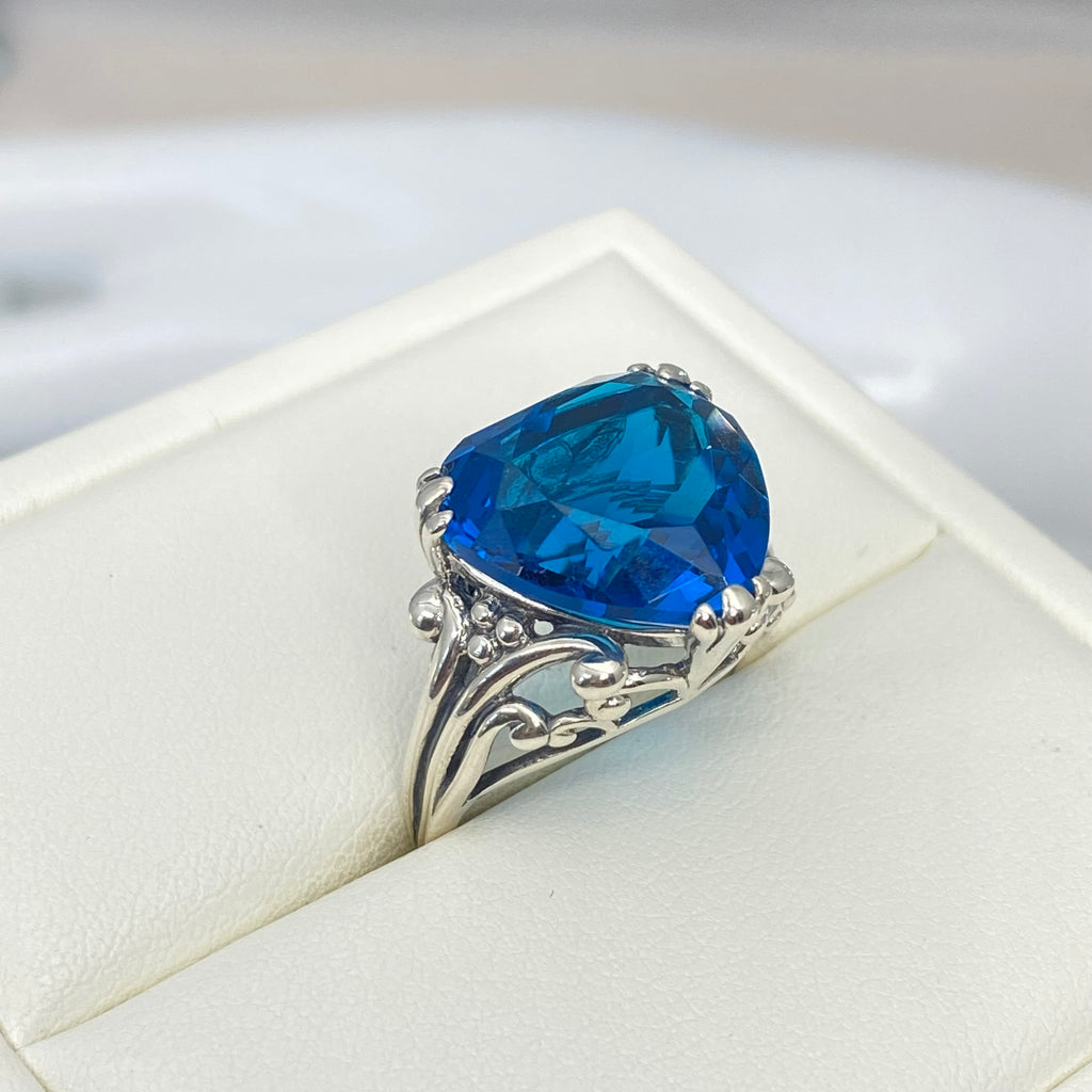 London Blue Topaz ring with a heart shaped gem and gothic style sterling silver filigree