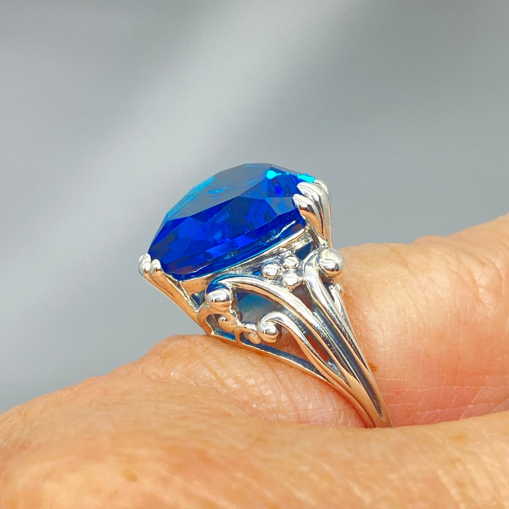 London Blue Topaz ring with a heart shaped gem and gothic style sterling silver filigree
