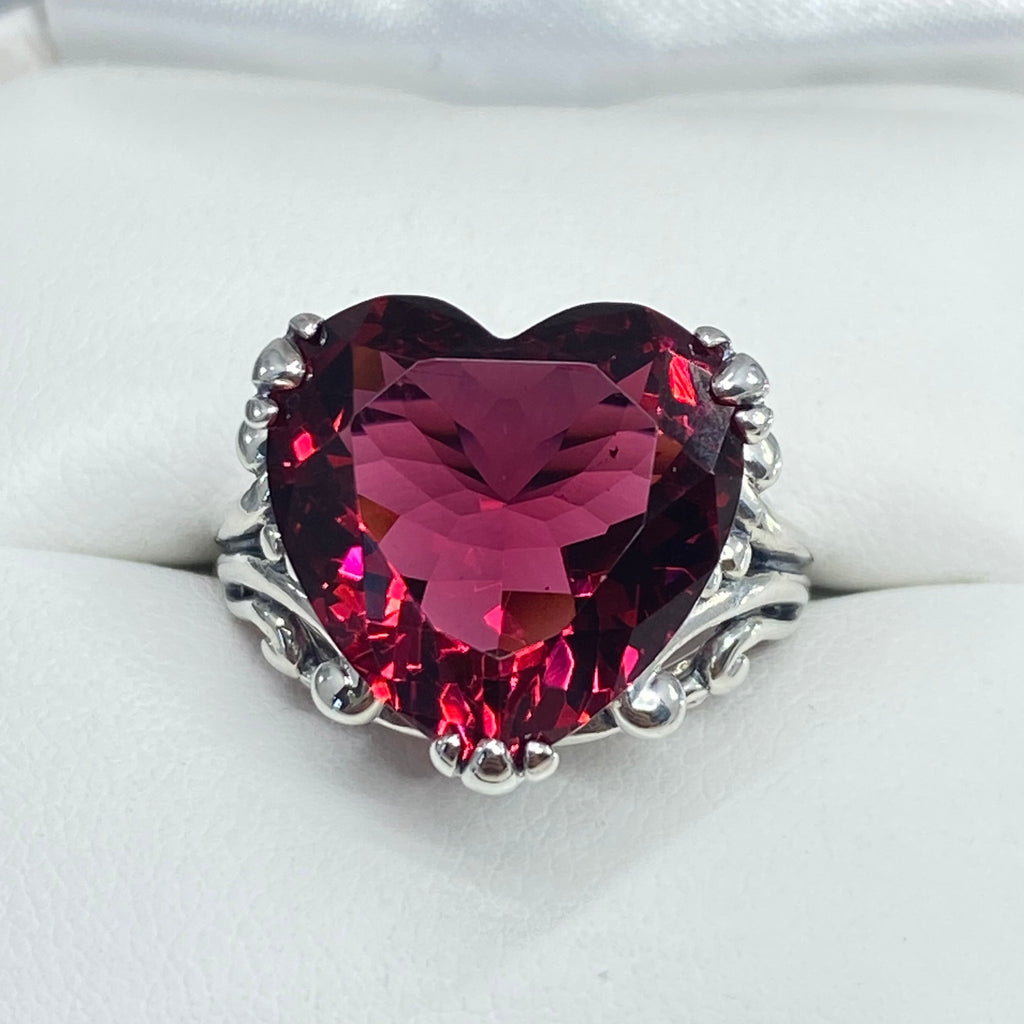 Heart-shaped red gemstone ring with silver band on white background, Ruby Ring, Heart Ring, Sterling Silver Filigree, silver Embrace Jewelry, D213