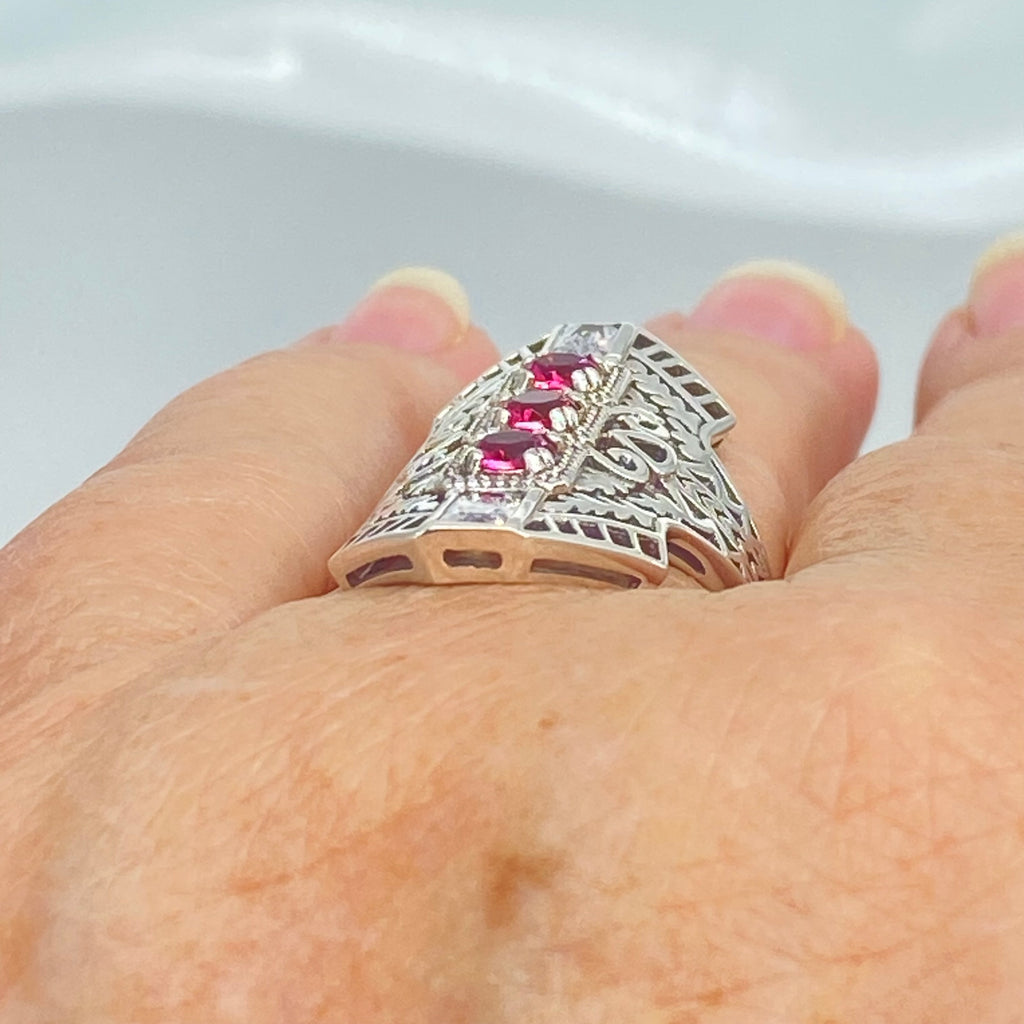 Ruby Red Art Deco Ring, with three round stones and two baguette stones, intricate 1930s sterling silver filigree adorns the ring and the band, Long Deco D214, Silver Embrace Jewelry