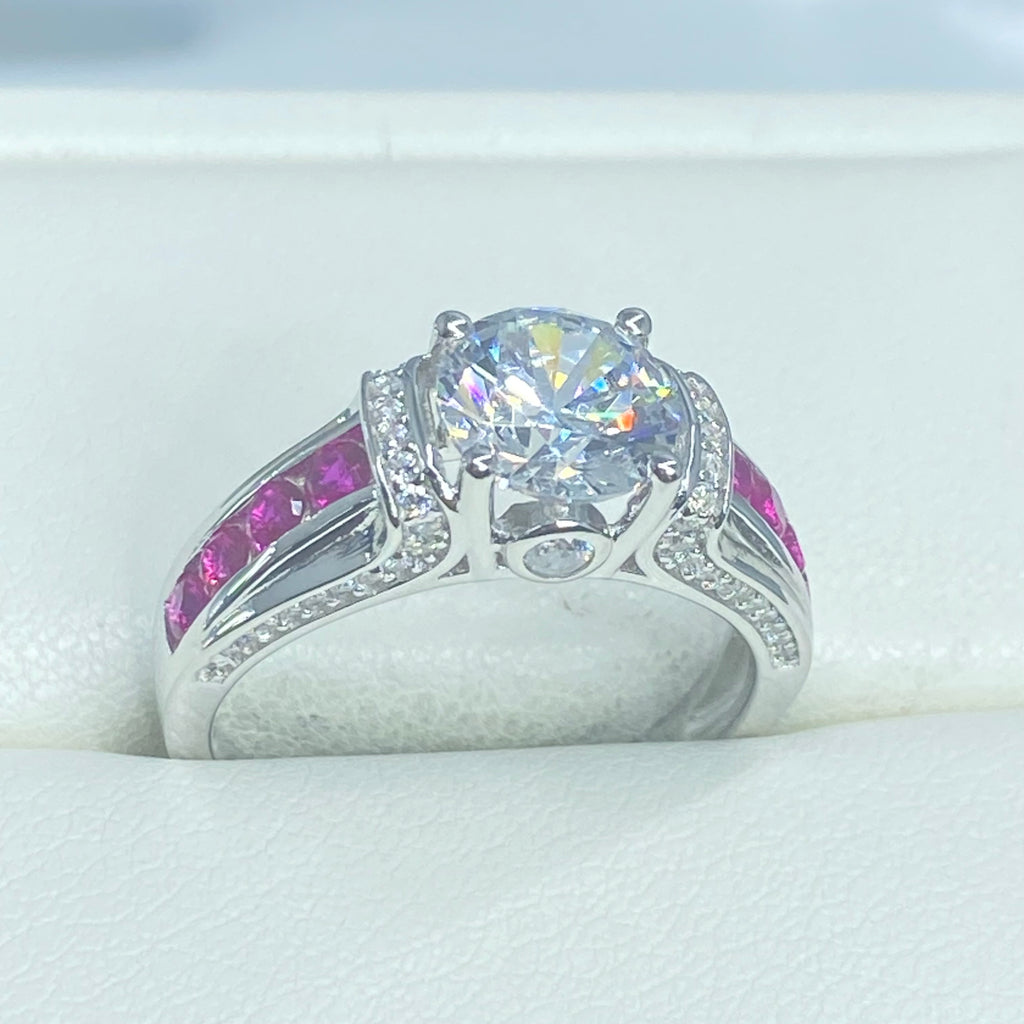 Silver ring with a large faux diamond and smaller pink stones on a white background, White CZ & Ruby Ring, D220, Deco Inlay design, Sterling silver filigree, Silver Embrace Jewelry