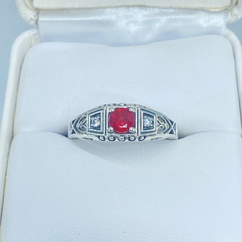 Art deco style ring with a natural ruby stone in the center, and two white CZ accents on either side set in sterling silver deco filigree, Silver Embrace Jewelry, DecoBand, D49 