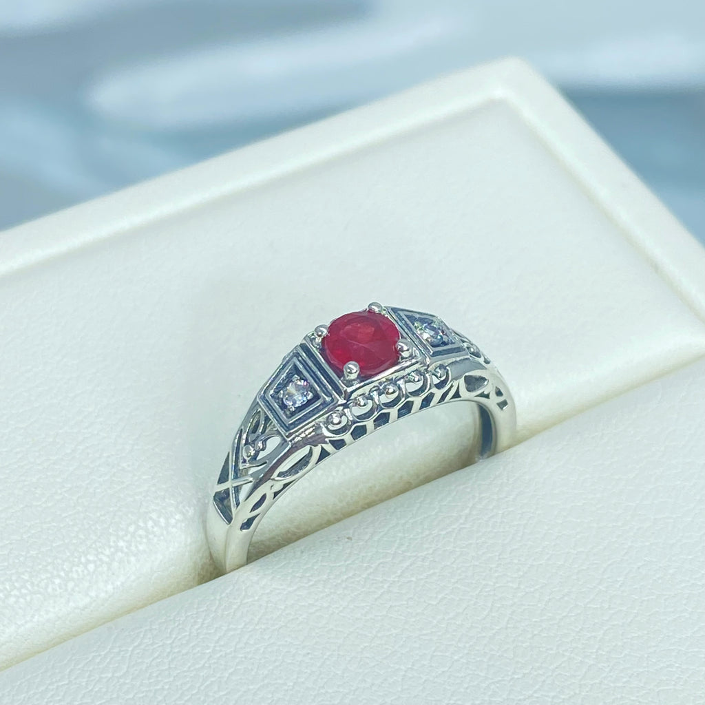 Art deco style ring with a natural ruby stone in the center, and two white CZ accents on either side set in sterling silver deco filigree, Silver Embrace Jewelry, DecoBand, D49 