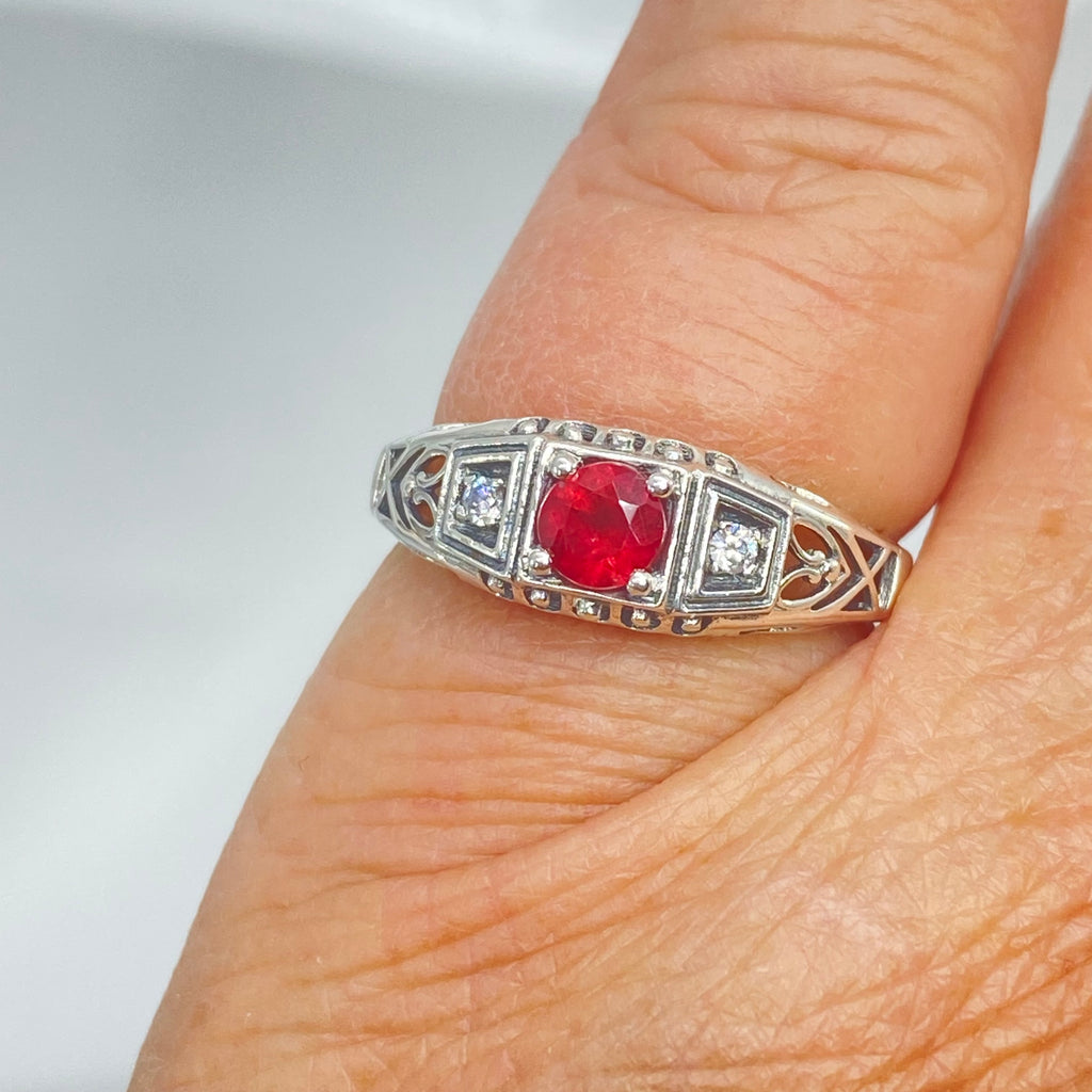 Art deco style ring with a natural ruby stone in the center, and two white CZ accents on either side set in sterling silver deco filigree, Silver Embrace Jewelry, DecoBand, D49 