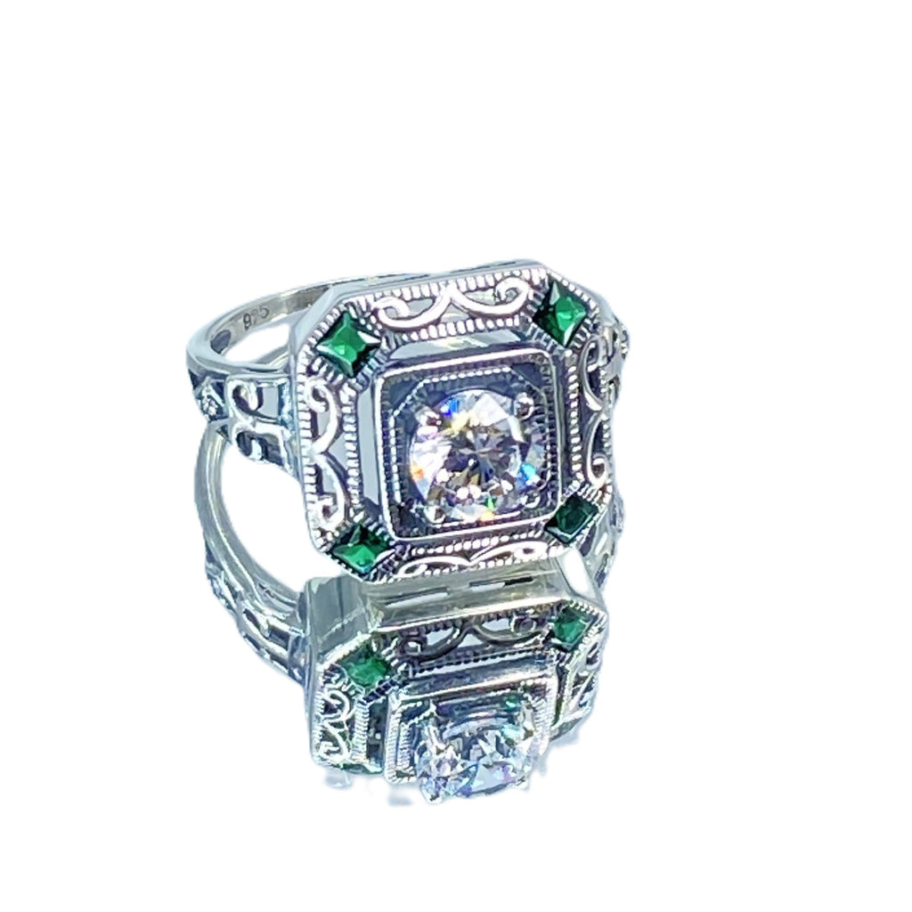 art deco style ring with a white CZ center stone and 4 emerald green gems in each corner of the octagonal sterling silver filigree, Silver Embrace Jewelry, D68