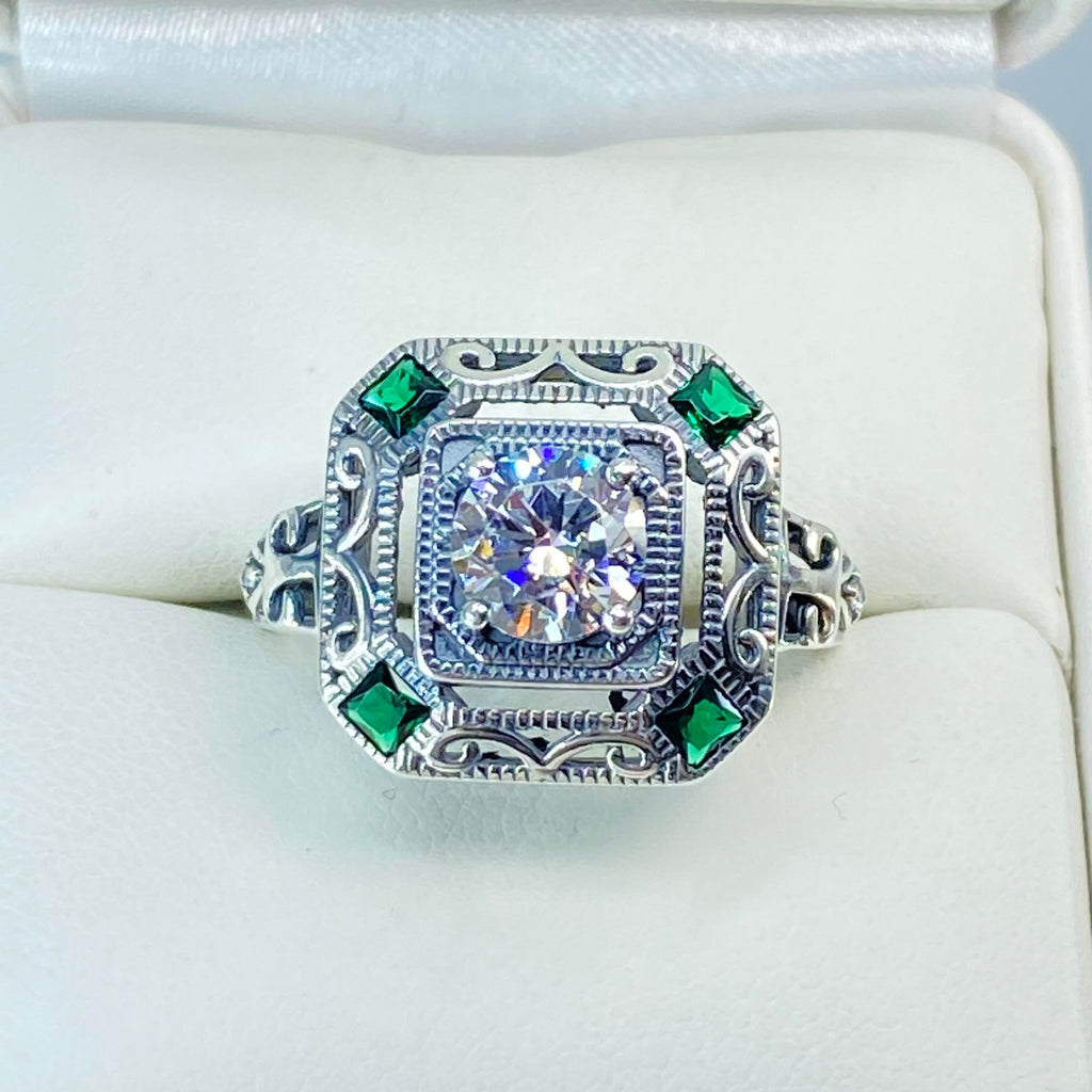 art deco style ring with a white CZ center stone and 4 emerald green gems in each corner of the octagonal sterling silver filigree, Silver Embrace Jewelry, D68