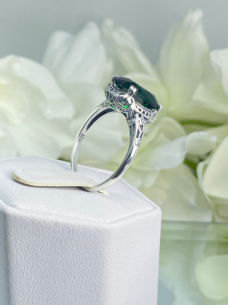 Emerald green Ring, Oval emerald green gemstone, sterling silver floral filigree, Edward Design #D70, on a ring holder