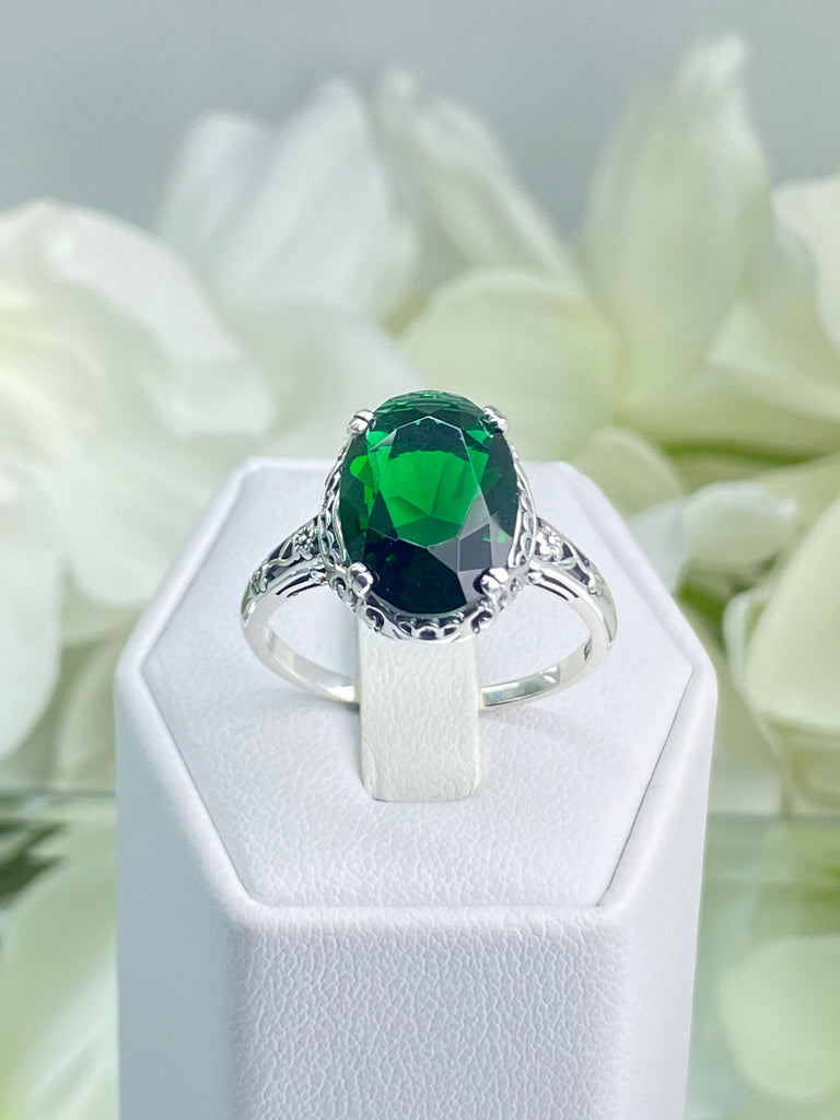 Emerald green Ring, Oval emerald green gemstone, sterling silver floral filigree, Edward Design #D70, on a ring holder