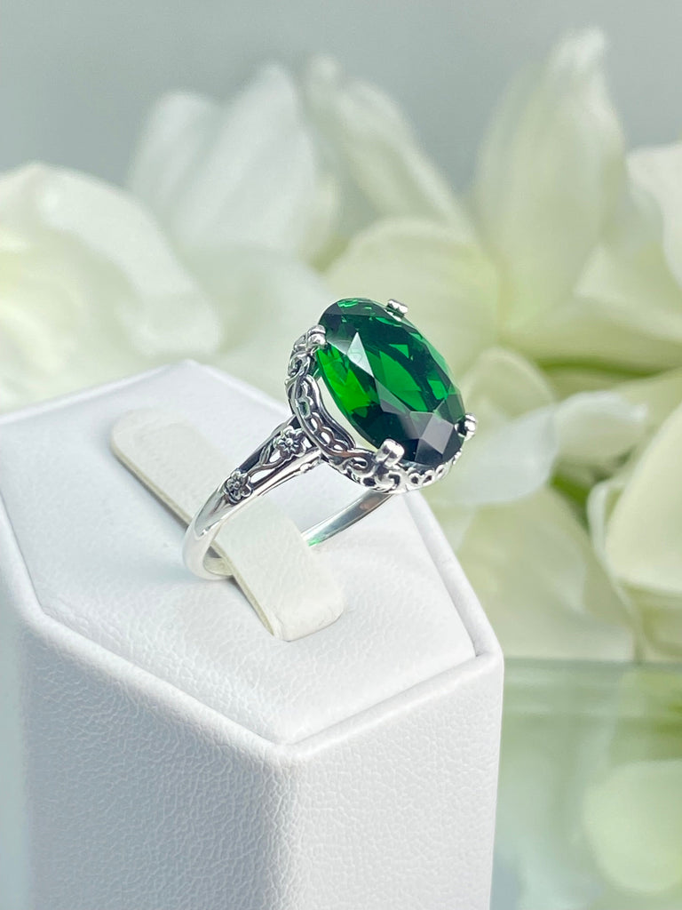 Emerald green Ring, Oval emerald green gemstone, sterling silver floral filigree, Edward Design #D70, on a ring holder