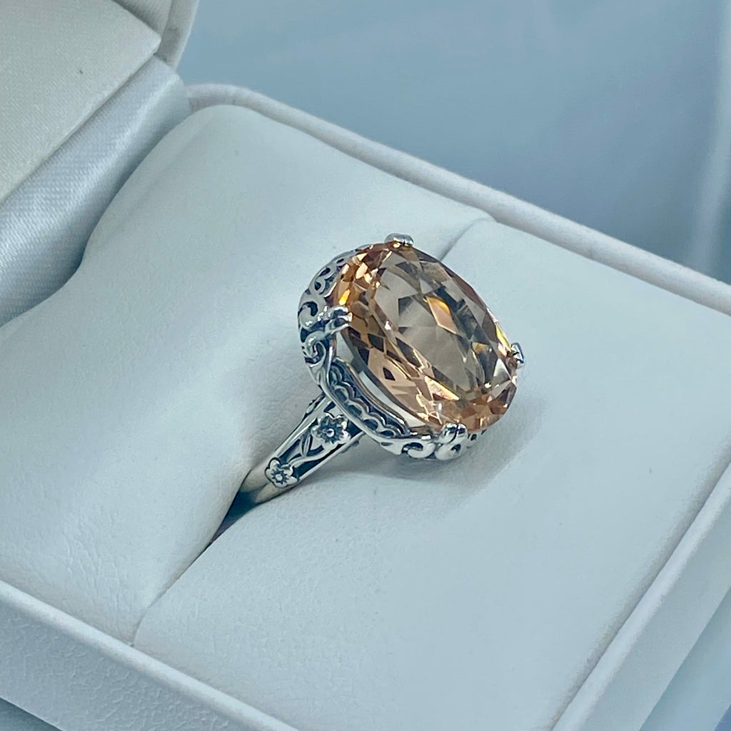 Peach Topaz ring, Sterling Silver floral Filigree, Edward design #D70, Silver Embrace Jewelry Silver ring with a large Peach gemstone in a jewelry box