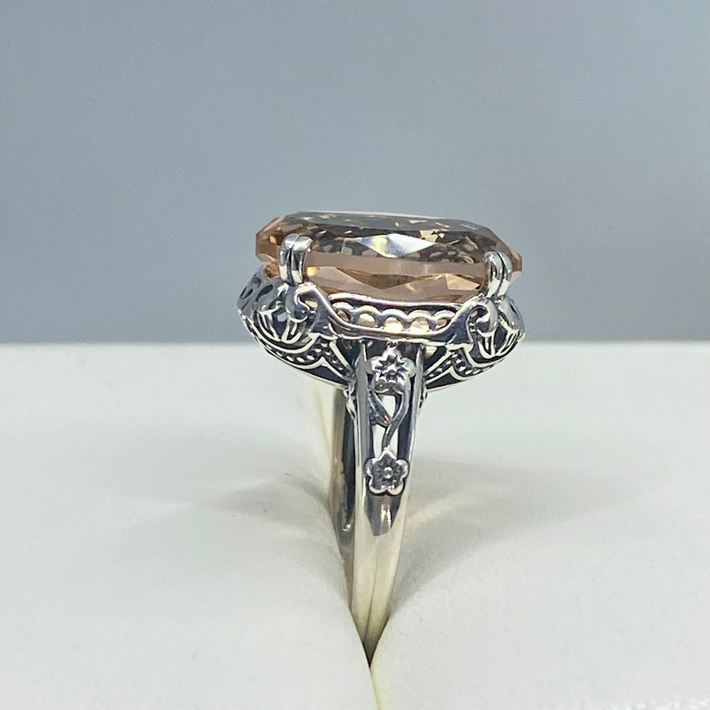 Peach Topaz ring, Sterling Silver floral Filigree, Edward design #D70, Silver Embrace Jewelry Silver ring with a large Peach gemstone in a jewelry box