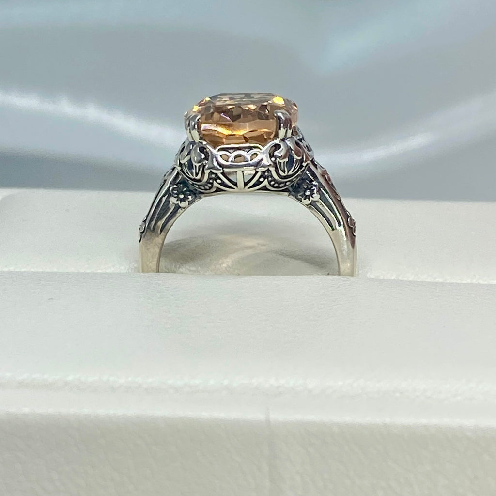 Peach Topaz ring, Sterling Silver floral Filigree, Edward design #D70, Silver Embrace Jewelry Silver ring with a large Peach gemstone in a jewelry box