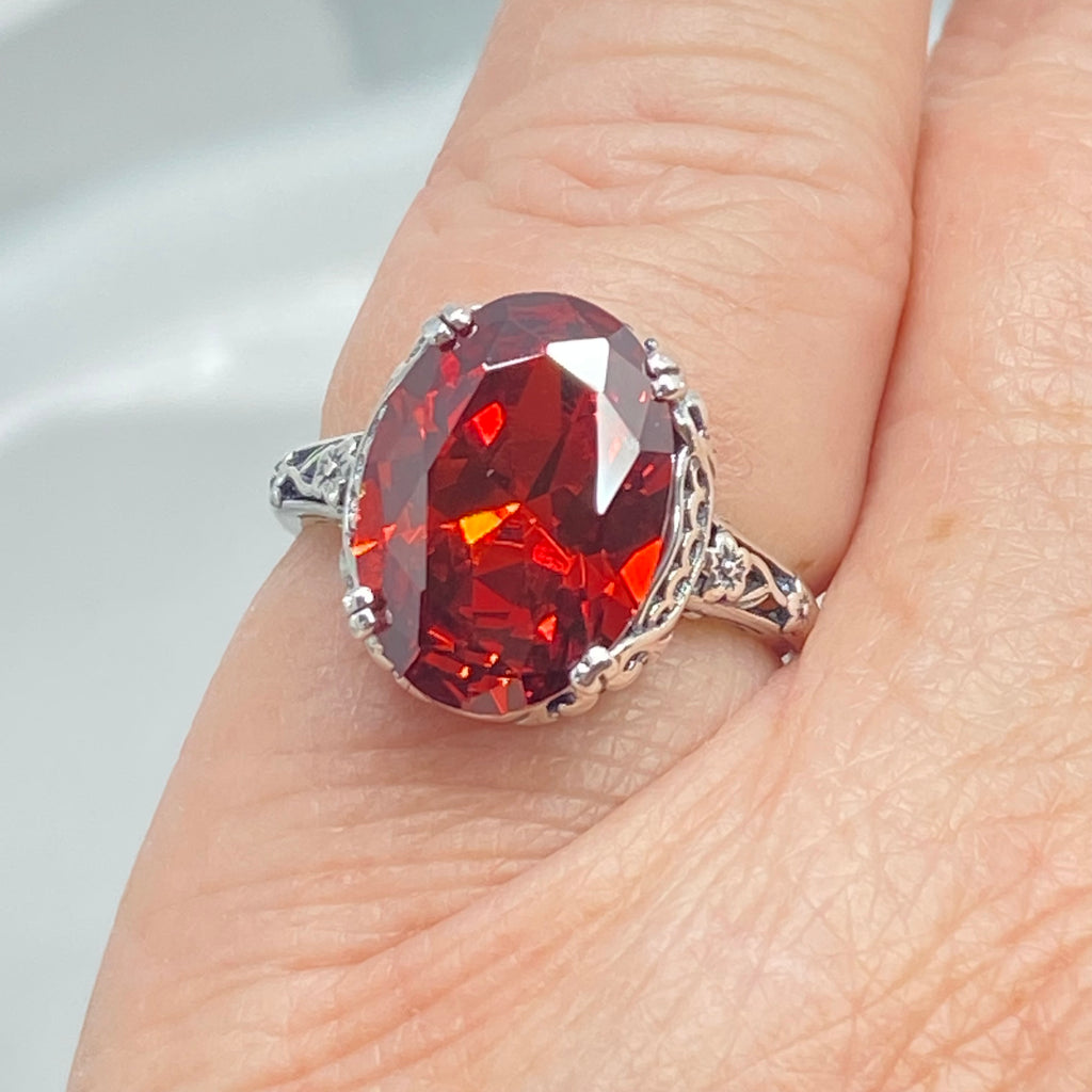 Red Garnet CZ Ring, Sterling Silver floral filigree, Edward Design #D70z, silver ring with garnet gemstone and floral filigree on a finger