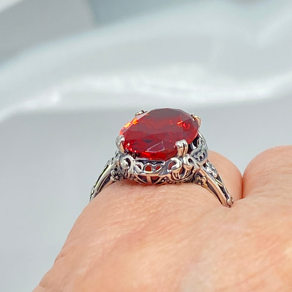 Red Garnet CZ Ring, Sterling Silver floral filigree, Edward Design #D70z, silver ring with garnet gemstone and floral filigree on a finger