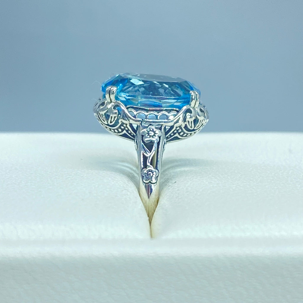 Natural Sky Blue Topaz Ring, 4.5 carat oval faceted stone, sterling Silver floral filigree, Edward design #D70z, top, offset and side views