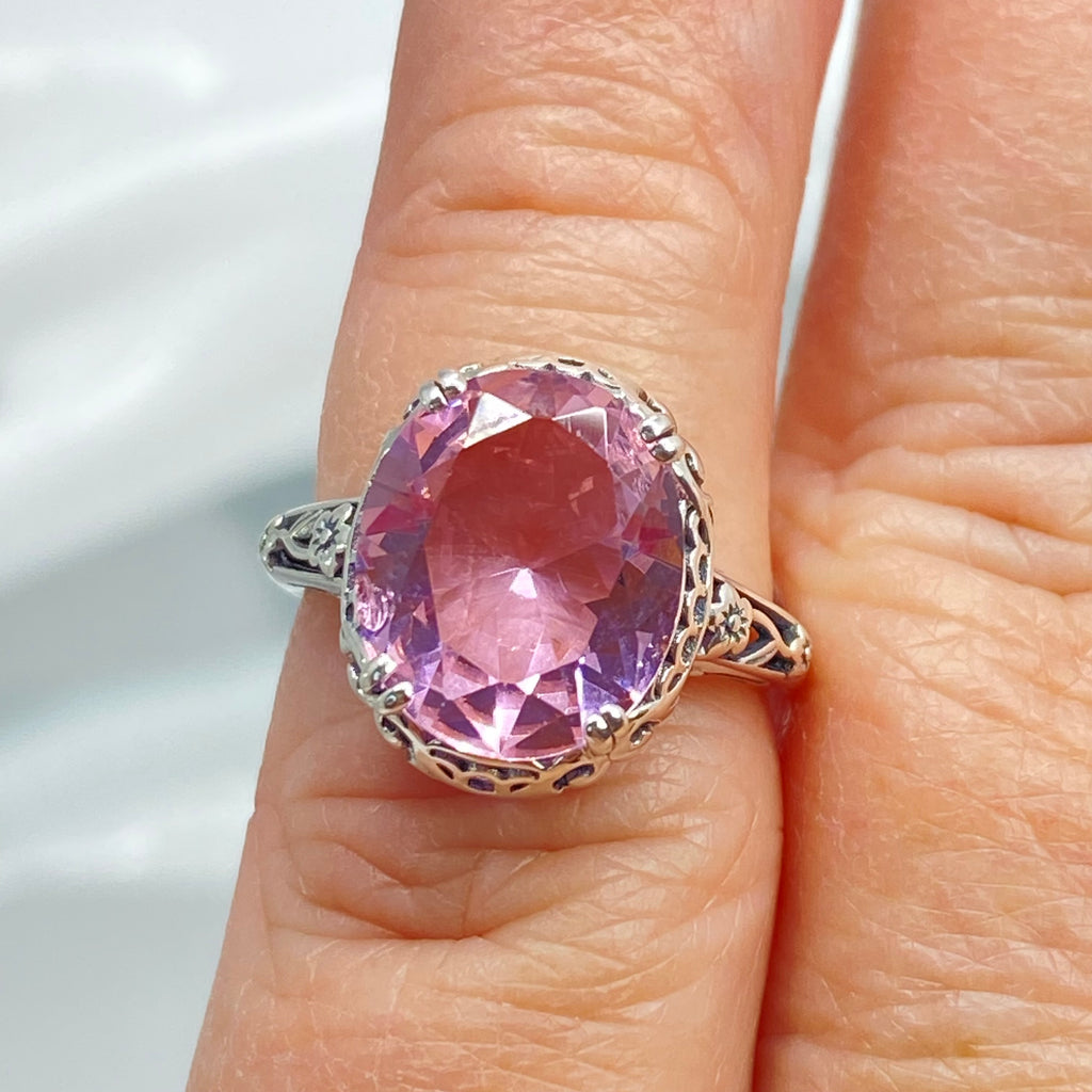Ring with a large pink topaz gemstone on a finger, Edward Design, sterling silver floral filigree, Silver Embrace Jewelry, D70z
