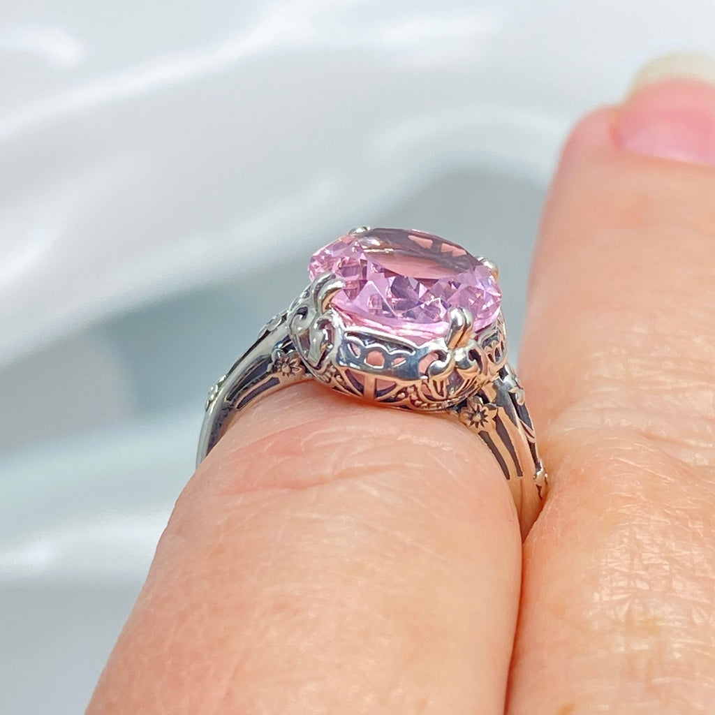 Ring with a large pink topaz gemstone on a finger, Edward Design, sterling silver floral filigree, Silver Embrace Jewelry, D70z