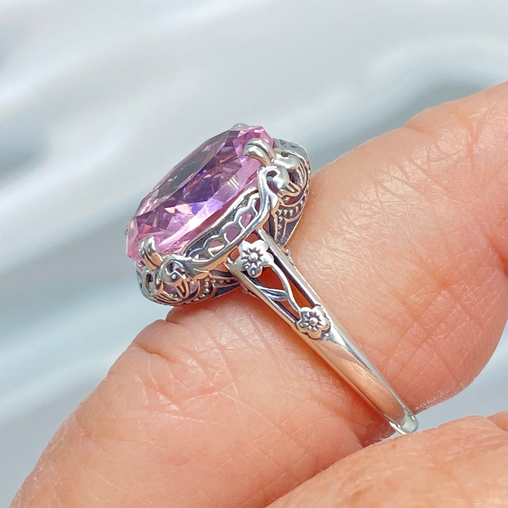 Ring with a large pink topaz gemstone on a finger, Edward Design, sterling silver floral filigree, Silver Embrace Jewelry, D70z
