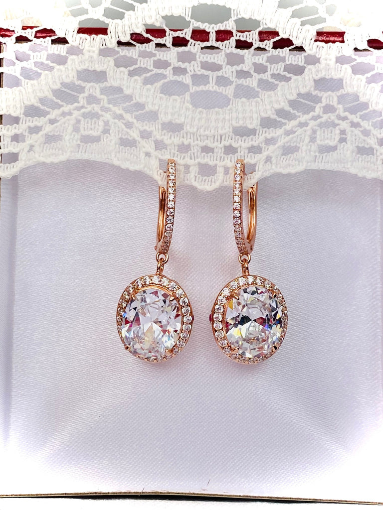 White CZ Earrings, with Rose Gold filigree, a bright sparkling CZ gemstone surrounded by more sparkling CZs with delicate rose gold filigree, latch back hooks with more CZs, Halo Earrings, E228, Silver Embrace Jewelry