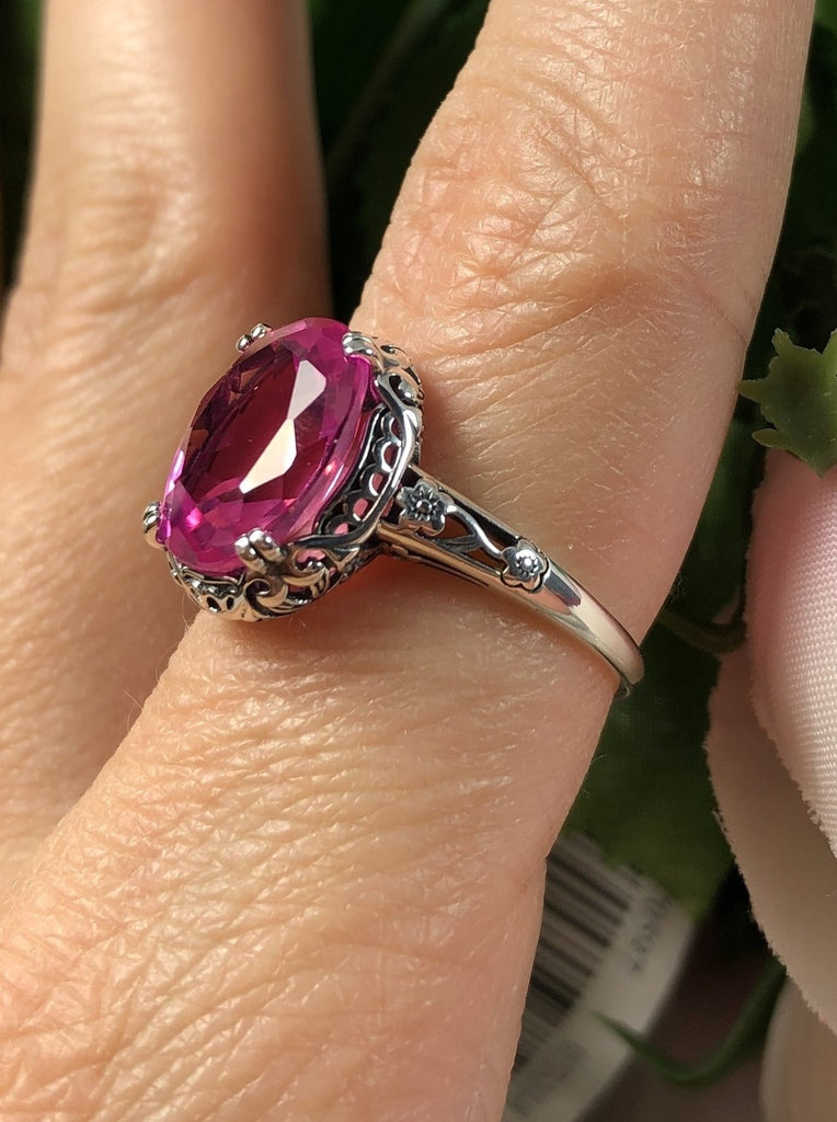 Natural Pink topaz Ring, 3.4 carat oval faceted gemstone, sterling silver floral filigree, Edward design #D70z, offset view on finger