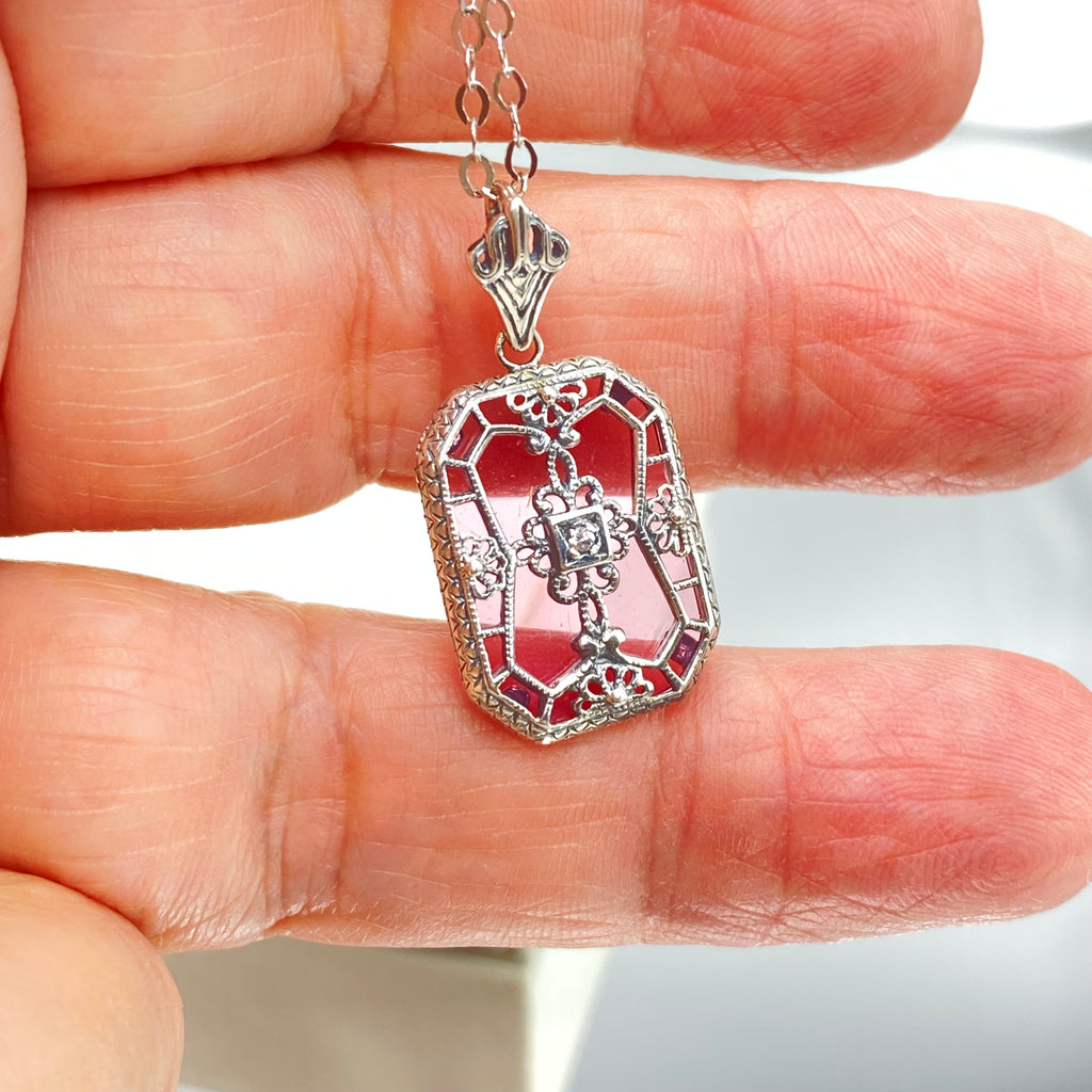 Pink Camphor Glass pendant with a CZ gem inset in the center, sterling silver filigree edging and across the glass face in window pane style, Silver Embrace Jewelry, P203
