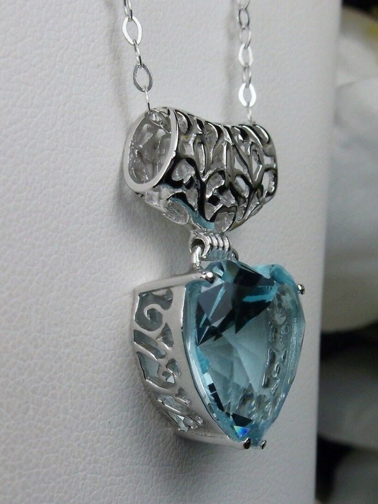 Heart shaped sky blue aquamarine pendant with sterling silver filigree detail, Silver Embrace Jewelry