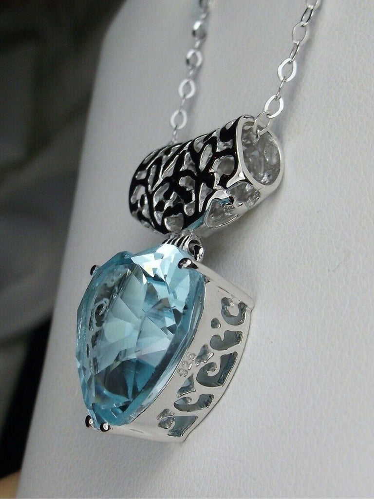 Heart shaped sky blue aquamarine pendant with sterling silver filigree detail, Silver Embrace Jewelry