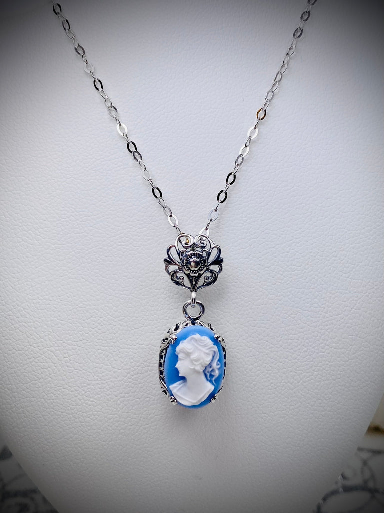 Blue & White Portrait Cameo pendant necklace, with an oval soft blue background & White Lady silhouette style cameo set in floral sterling silver filigree, 4 prongs hold the cameo in place, Silver Embrace Jewelry, Edward P70, Vintage Edwardian Jewelry